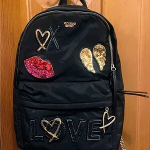 Victoria's Secret Black Backpack with Gold and Red Details